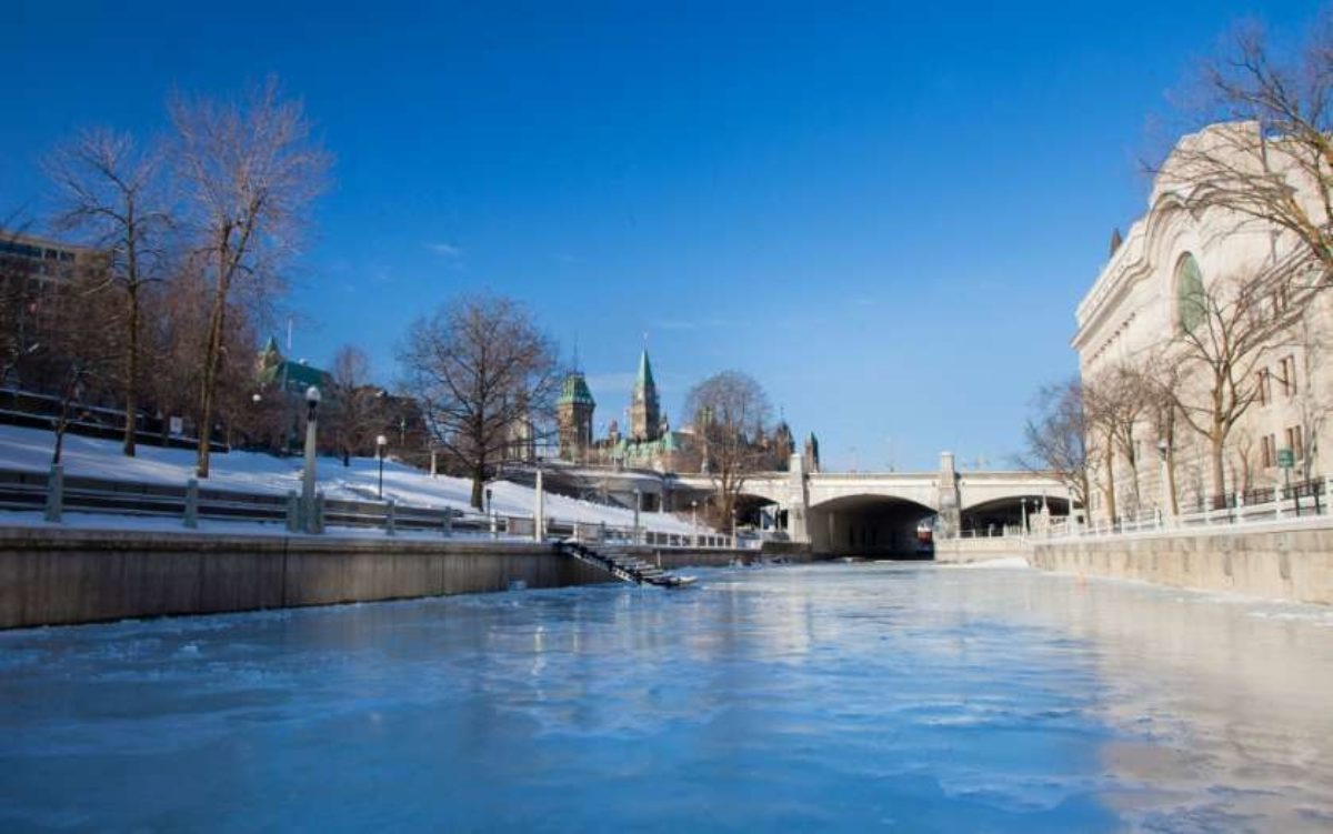 The downtown portion of the Rideau Canal Skateway, with Parliament Hill and the Senate of Canada Building in the background.